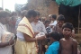 Sri Baba distributing relief food to victims